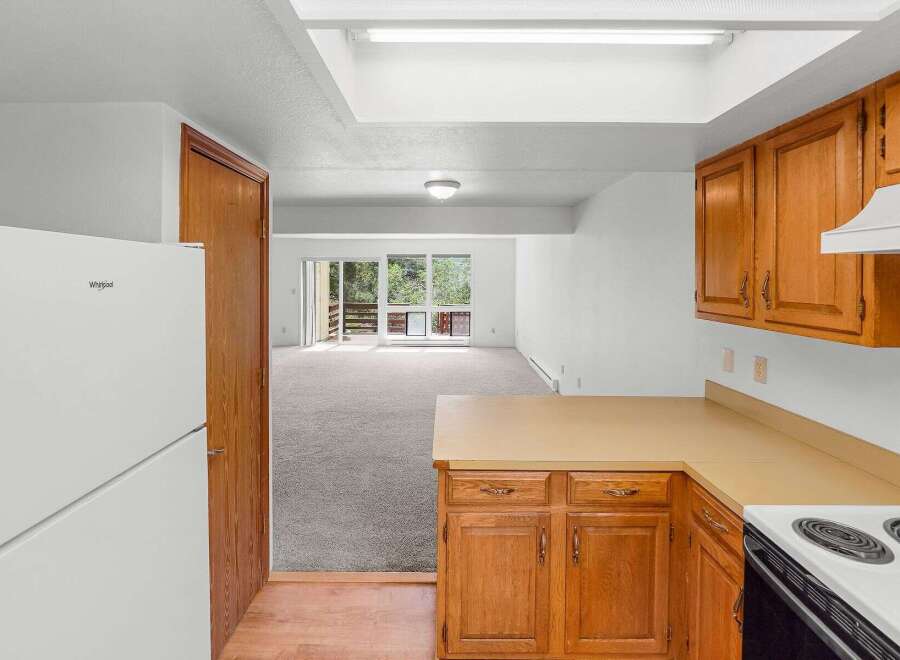 Discover this charming home featuring a bright and airy living space with a large skylight and ample natural light.