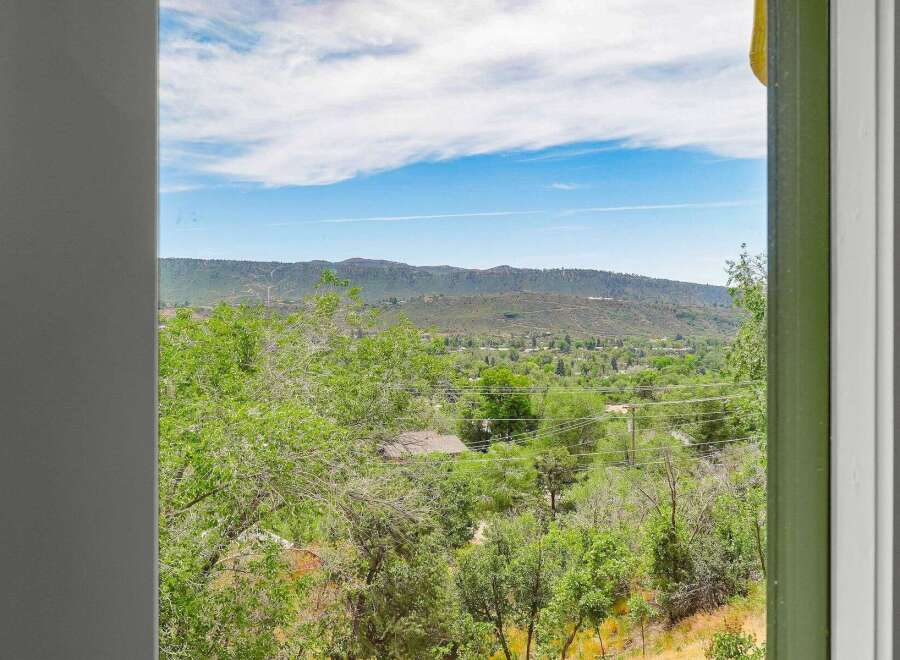 Enjoy breathtaking views of rolling hills and a serene landscape from this property.
