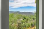 Enjoy breathtaking views of rolling hills and a serene landscape from this property.