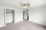 Discover comfort and convenience in this spacious room featuring a ceiling fan for optimal air circulation and ample closet space for all your storage needs.
