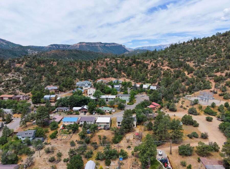 Nestled in a picturesque mountain setting, this charming home offers a serene escape with stunning natural views.