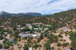 Nestled in a picturesque mountain setting, this charming home offers a serene escape with stunning natural views.
