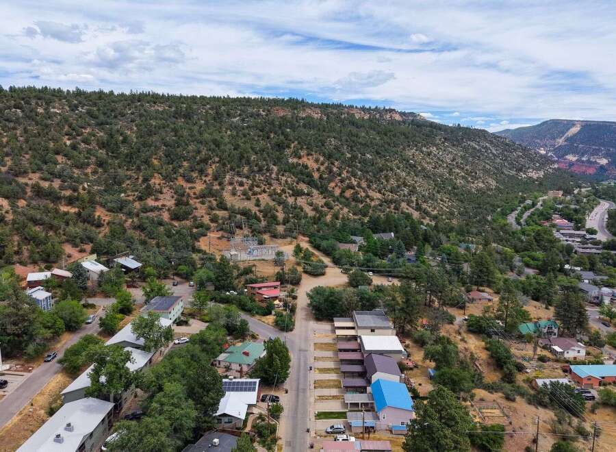 Discover this charming property nestled in a picturesque mountain setting, offering a unique blend of natural beauty and community living.