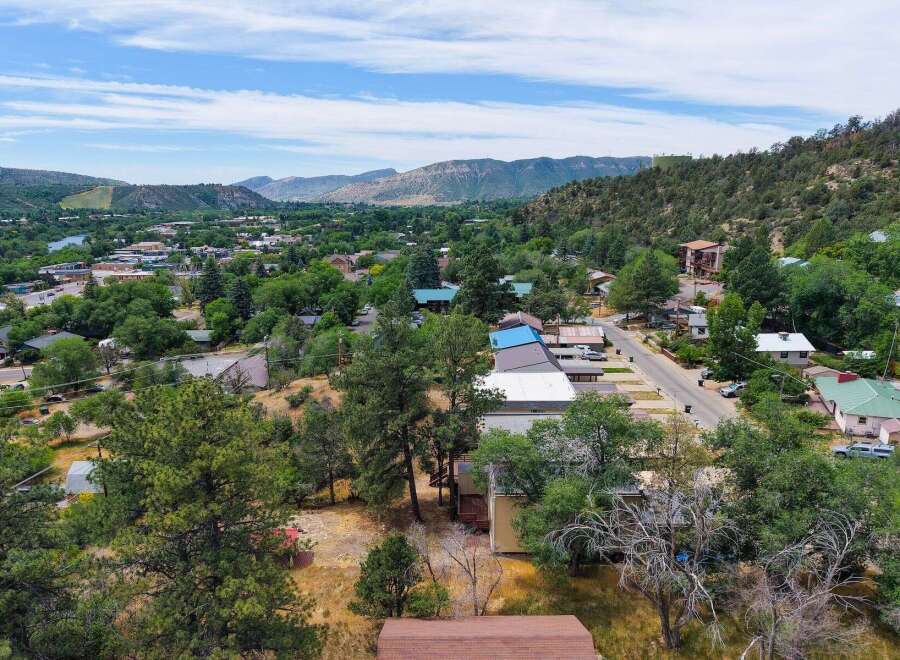 Discover this charming property nestled amidst lush greenery and scenic mountain views.