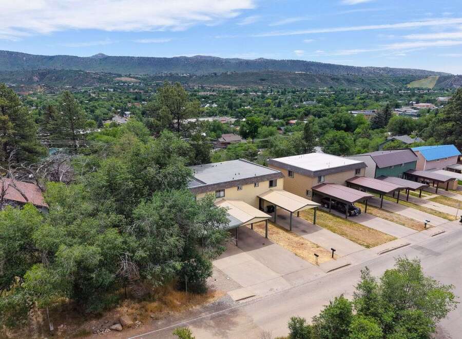 Discover this charming property featuring multiple units, each with its own carport for convenient parking.