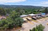 Discover this charming property featuring multiple units, each with its own carport for convenient parking.