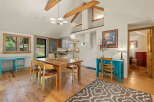 This charming dining area features a rustic wooden table with four chairs, perfect for intimate gatherings.