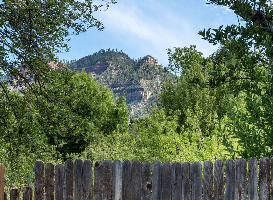 Escape to this stunning property offering breathtaking views of majestic mountains and lush greenery.