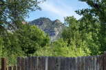 Escape to this stunning property offering breathtaking views of majestic mountains and lush greenery.