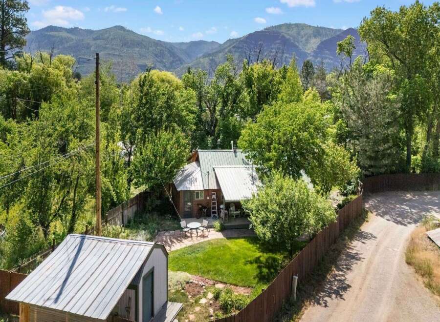 Nestled amidst lush greenery and majestic mountain views, this charming property offers a serene escape.