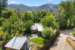 Nestled amidst lush greenery and majestic mountain views, this charming property offers a serene escape.