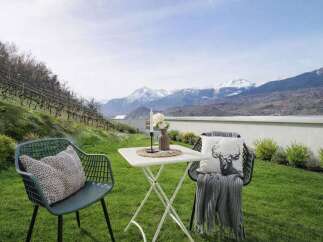 Enjoy breathtaking mountain views from this charming outdoor seating area, perfect for relaxing or entertaining.