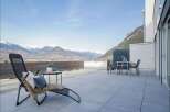 Experience breathtaking mountain views from this stunning modern terrace, perfect for outdoor relaxation and entertaining.