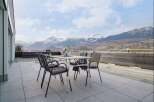 Enjoy breathtaking mountain views from this stunning patio, perfect for outdoor dining and relaxation.