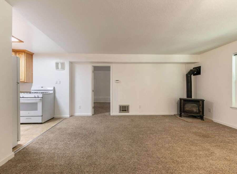 Cozy living space featuring a charming wood-burning stove, perfect for chilly evenings.