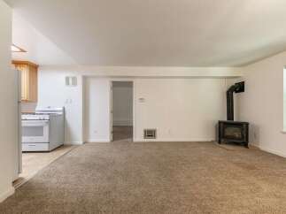 Cozy living space featuring a charming wood-burning stove, perfect for chilly evenings.