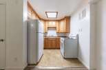 Discover this charming kitchen featuring warm wooden cabinetry and a functional layout.