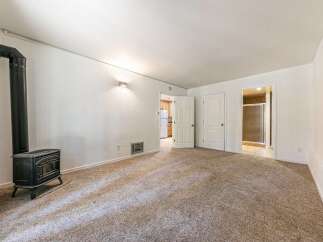 Cozy living space featuring a charming black wood-burning stove, perfect for chilly evenings.