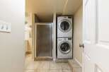 Discover the convenience of in-unit laundry with this stacked LG washer and dryer set, perfectly integrated into a compact laundry nook.