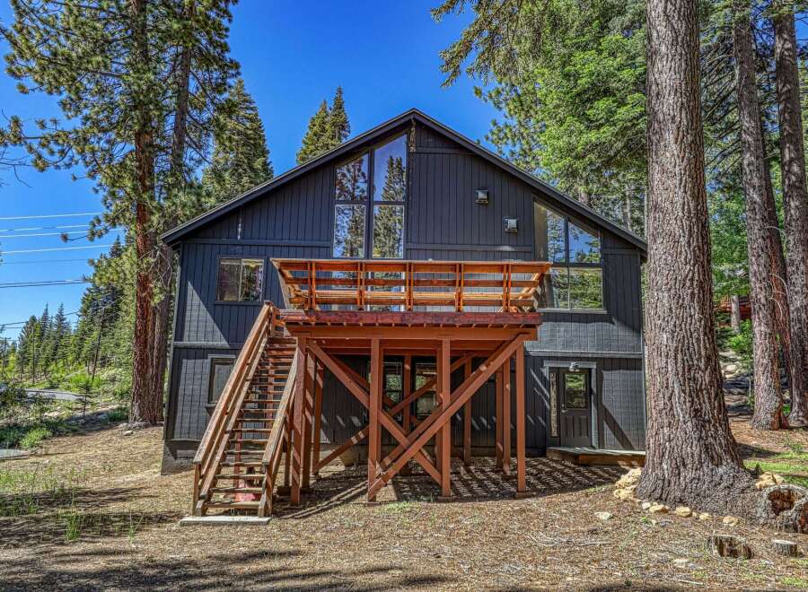 Experience mountain living in this stunning modern cabin, nestled amongst towering pine trees.