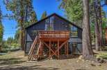 Experience mountain living in this stunning modern cabin, nestled amongst towering pine trees.