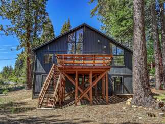 Experience mountain living in this stunning modern cabin, nestled amongst towering pine trees.