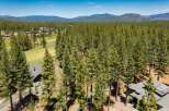 Experience luxury living nestled amongst towering pine trees with this stunning property.