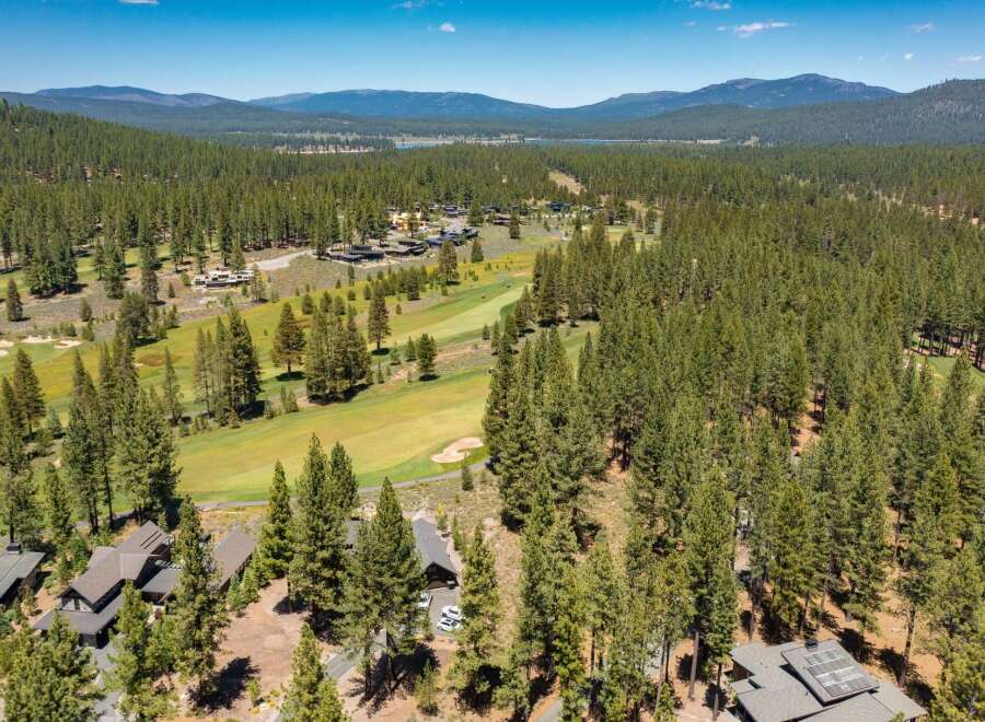Experience luxury living nestled amidst a pristine pine forest with stunning golf course views.
