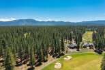 Experience luxury living nestled amidst a pristine pine forest with stunning mountain views.