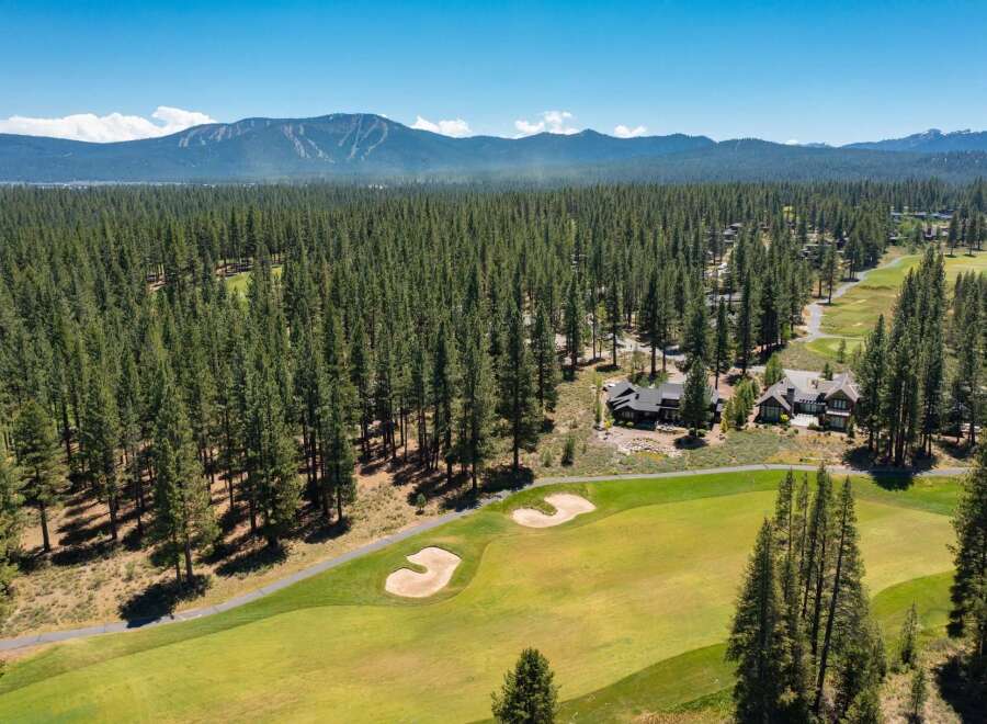 Experience luxury living nestled within a pristine pine forest, adjacent to a championship golf course.