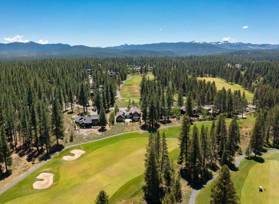 Experience luxury living nestled within a pristine pine forest and adjacent to a championship golf course.