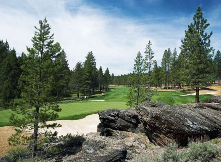 Experience luxury living with this stunning golf course view, featuring manicured greens and challenging sand traps.