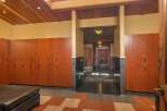 Step into a world of refined comfort with this beautifully appointed locker room, featuring rich cherry wood lockers equipped with digital locks for ultimate security and convenience.