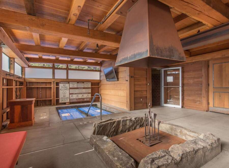Experience ultimate relaxation in this indoor spa area, featuring a covered hot tub perfect for unwinding.