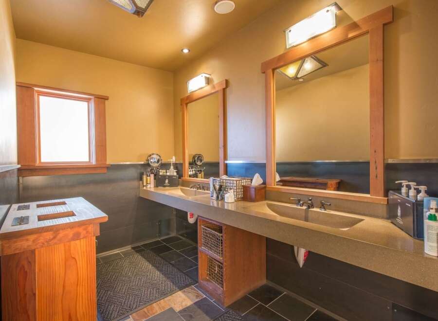 This spacious bathroom features a double vanity with two sinks, perfect for busy households or guests.