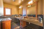 This spacious bathroom features a double vanity with two sinks, perfect for busy households or guests.