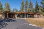 Experience modern living in this stunning home featuring expansive glass walls that seamlessly blend indoor and outdoor spaces.