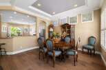 This elegant dining room features a classic oval dining table with ornate chairs, perfect for hosting memorable meals.