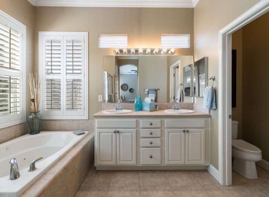 Indulge in relaxation in this luxurious bathroom, featuring a spacious jetted tub perfect for unwinding.