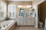 Indulge in relaxation in this luxurious bathroom, featuring a spacious jetted tub perfect for unwinding.