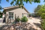 Enjoy outdoor living in this spacious backyard featuring a large flagstone patio perfect for entertaining.