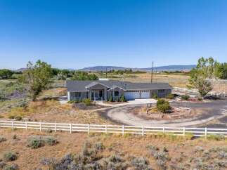 Discover this stunning single-story home featuring a spacious layout and a welcoming facade.