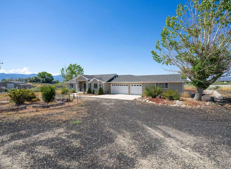 Discover this stunning single-story home featuring a spacious three-car garage and a welcoming covered entryway.