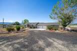 Discover this stunning single-story home featuring a spacious three-car garage and a welcoming covered entryway.
