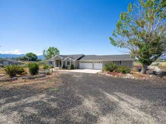 Discover this stunning single-story home featuring a spacious three-car garage and a welcoming covered entryway.