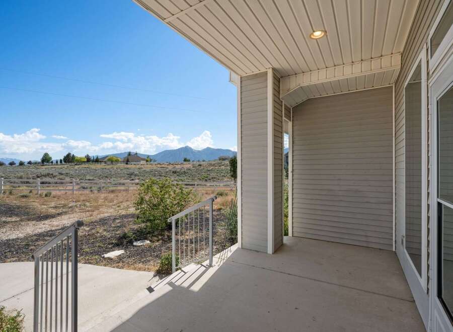Enjoy breathtaking mountain views from this charming property's covered porch.