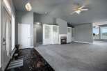 Step into this spacious living area featuring a cozy fireplace and elegant built-in shelving.