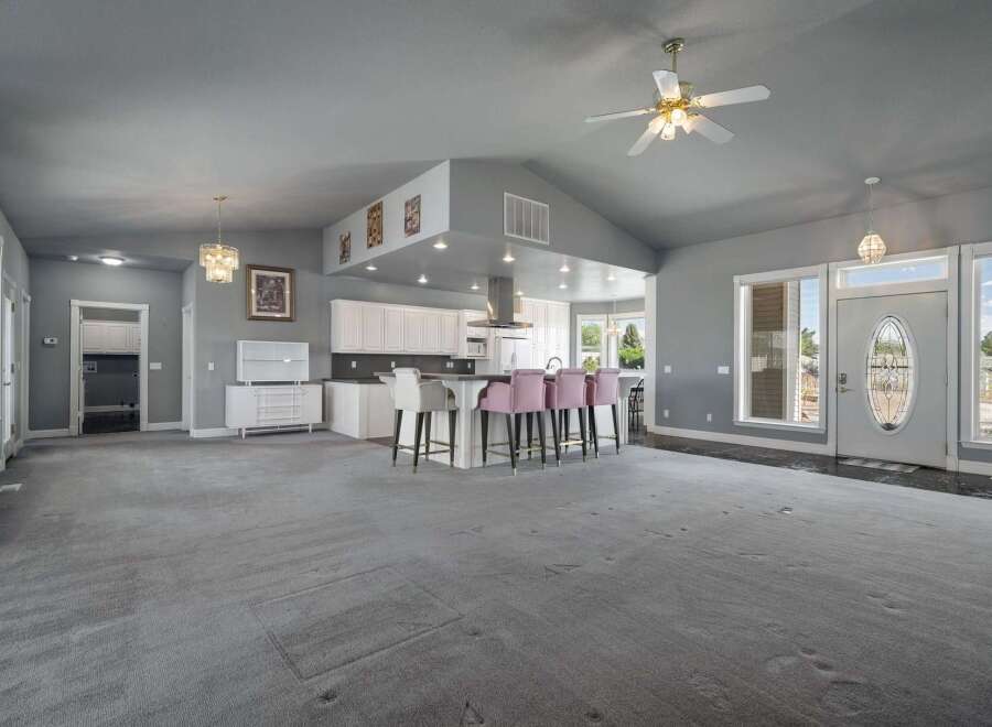 Step into this spacious open-concept living area, perfect for entertaining.