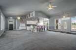 Step into this spacious open-concept living area, perfect for entertaining.