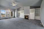 Step into this spacious living room featuring a cozy fireplace and elegant built-in display cabinets.
